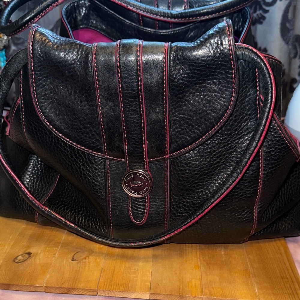 Cole Haan hand bag in black with magenta stitch and inside